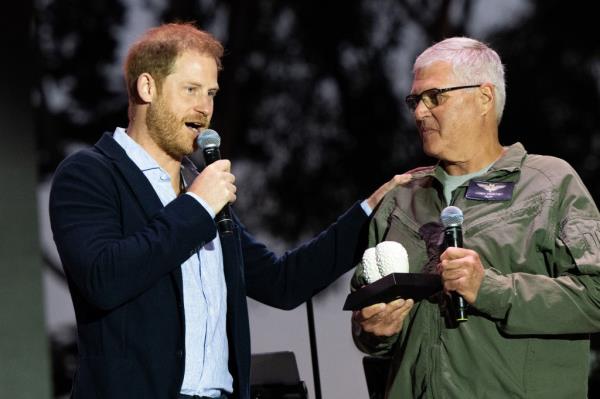 Harry's duties Friday night included presenting an award to Santa Barbara County Sheriff's Office helicopter pilot Loren Courtney.